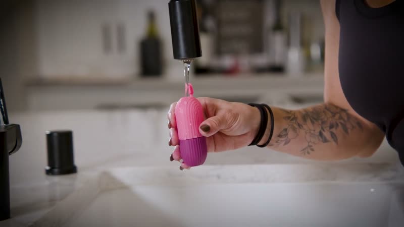 Beauty product demo still, ice roller under running water